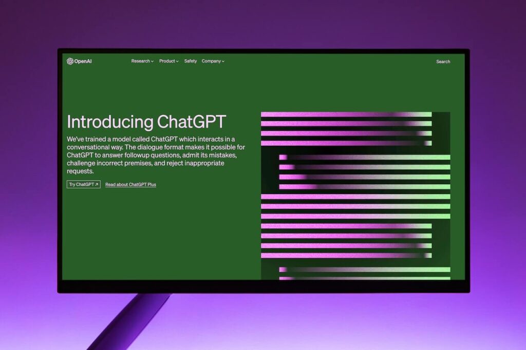 A laptop screen showing the homepage of the ChatGPT page on openai.com.